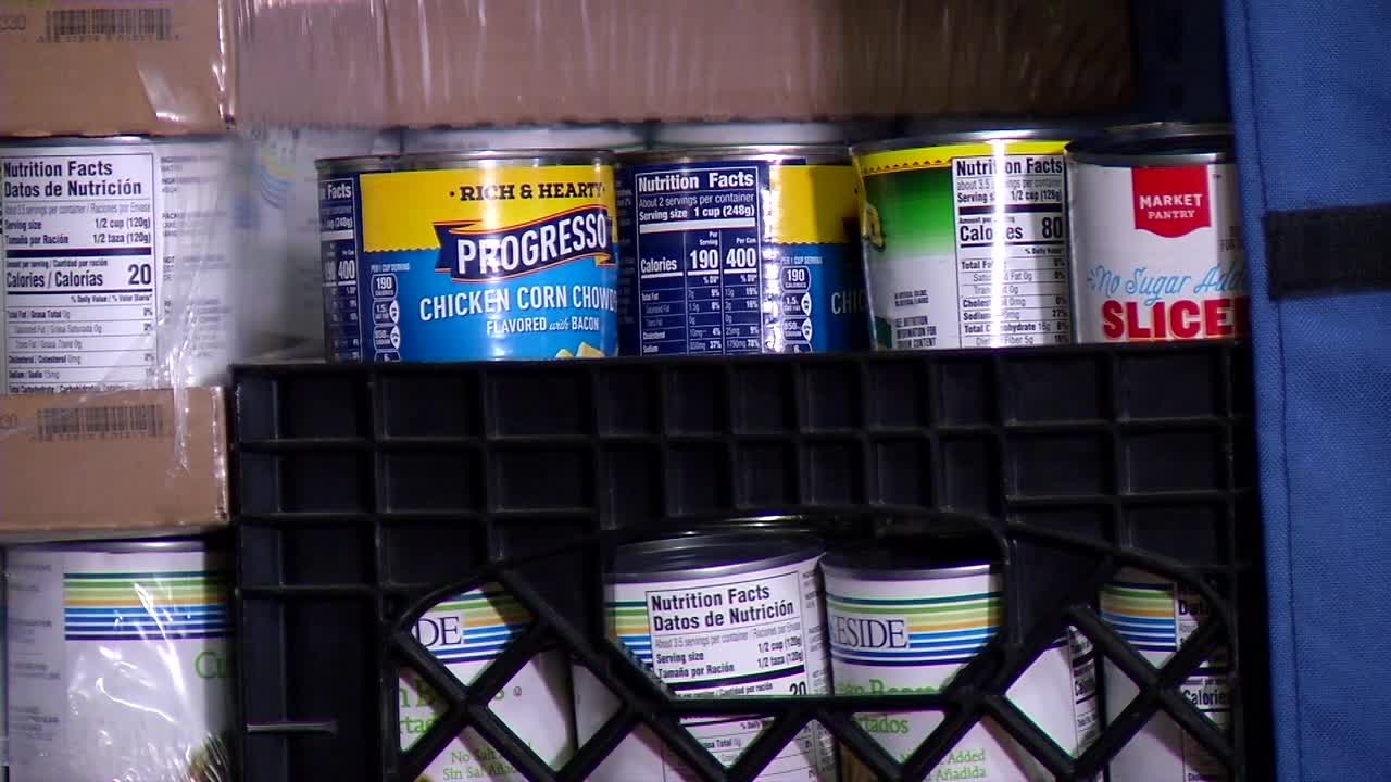 Families gather at a food shelf in Minnesota during rising costs of living.